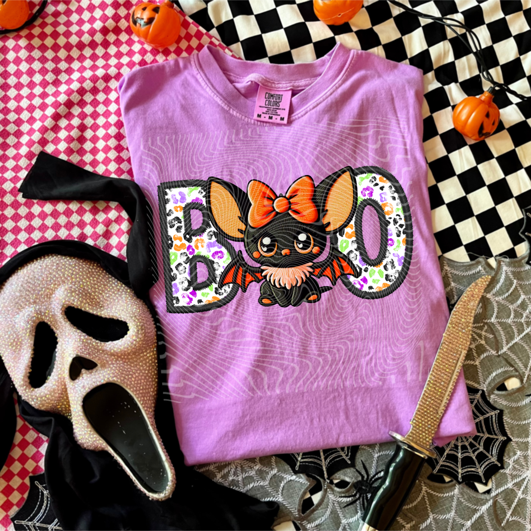 Boo with orange bow bat